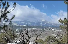  ?? Photo by Wendilyn Grasseschi ?? Mammoth Mountain still looks like winter but after what is now recorded as the driest January and February on record, the lower elevations of the Sierra are fast turning brown. Snow is finally in the forecast this week and perhaps into the second week of March, but there are still no signs of any storms large enough to bring the Sierra snowpack close to normal.