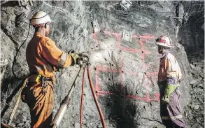  ?? ACACIA MINING / THE CANADIAN PRESS ?? Acacia Mining workers drill into rock in an undergroun­d mine in Africa.