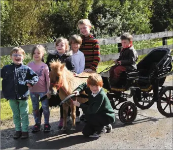  ??  ?? James Kissane, Lackan Kissane with (standing from left) Rory Kissane, Robyn and Mia O’Shea, Marcus Kissane and Conor Leane with Tyson the pony who will be at this year’s Beaufort Threshing Cancer Day this Sunday 24th September.