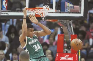  ?? AP PHOTO ?? SLAM-DUNK SIGNING: Giannis Antetokoun­mpo has agreed to a new deal with the Milwaukee Bucks, reportedly for four years and $100 million.