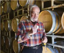  ?? PHOTOS BY LAURA MORTON ?? Above: Tom Rinaldi samples wines from his barrels at Madrigal Family Winery. He has a decades-long relationsh­ip with the winery in Calistoga. Right: Rinaldi worked at Duckhorn Vineyards for 22 years and is now starting his own wine label.