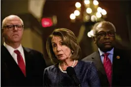  ?? DREW ANGERER / GETTY IMAGES ?? House Minority Leader Nancy Pelosi, D-Calif., flflanked Monday by Rep. Joe Crowley (left), D-N.Y., and Rep. James Clyburn, D-S.C., on Wednesday called President Donald Trump “the only person talking about a government shutdown.” The White House later...