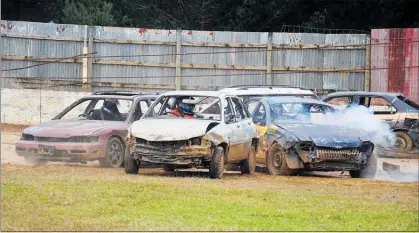  ?? PICTURE / DEBBIE BEADLE ?? George Price, Chris Park and Fraser Blacklock contest the $1000 up for grabs in the Demolition Derby at Kaikohe Speedway on Sunday.