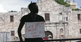  ?? Staff file photo ?? Historians say slavery played a role but was just one of the causes behind the Texas Revolution. Above, the Alamo is the backdrop for a May 2020 demonstrat­ion following George Floyd’s death.