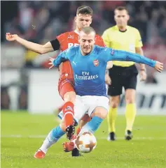  ??  ?? Cologne’s Salih Ozcan and Arsenal’s Jack Wilshere (right) vie for the ball during the UEFA Europa League Group H match in Cologne, western Germany. — AFP photo