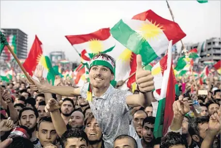  ?? Chris McGrath Getty Images ?? SUPPORTERS OF an independen­t Iraqi Kurdish state pack Irbil Stadium in Iraq on Friday ahead of Monday’s planned referendum. Kurdish leaders say their region, which has suffered major losses in the fight against Islamic State, has earned the right to...