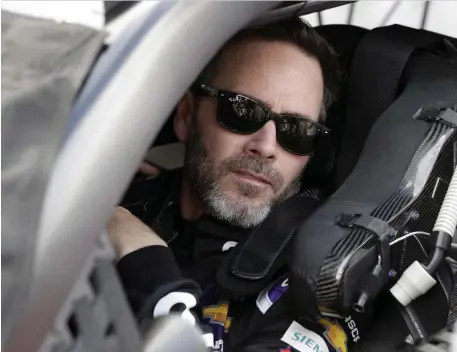  ?? AP ?? Jimmie Johnson sits in his car before the Daytona 500 at Daytona Internatio­nal Speedway on Feb. 16 in Daytona Beach, Fla.