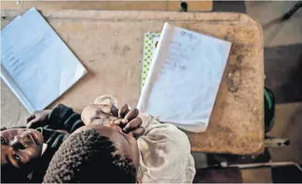  ?? Photo: Madelene Cronjé ?? Home works: Children whose parents encourage them to read and help with their schoolwork are about two years ahead of those learners who get no support at home.