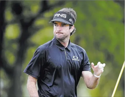  ?? Eric Gay ?? The Associated Press Bubba Watson sheepishly waves to the gallery after beating Kevin Kisner 7 and 6 to capture the Dell Technologi­es Match Play championsh­ip Sunday in Austin, Texas. Watson advanced to the final with a 3-and-2 semifinal victory over...