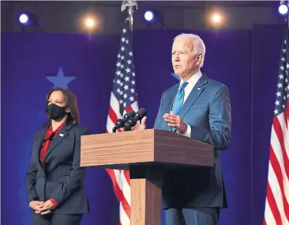  ?? ANGELA WEISS AFP VIA GETTY IMAGES ?? After scrapping plans for a larger rally, Joe Biden and Kamala Harris took the stage late Friday. “What’s becoming clearer each hour is that a record number of Americans of all races, faiths, religions, chose change over more of the same,” Biden said.