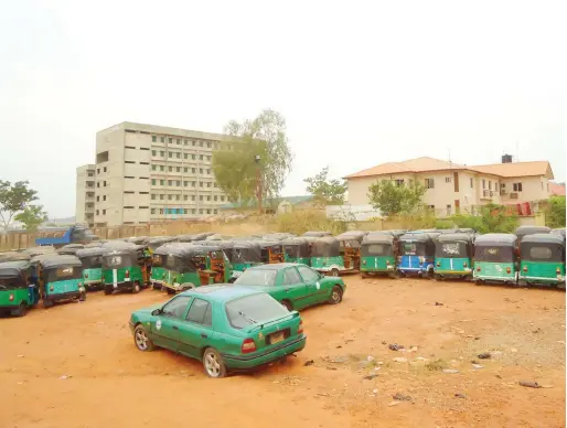  ?? PHOTO: ?? Vehicles and tricycles impounded at the VIO office in Mabushi at the weekend.
OGECHI OHALEE