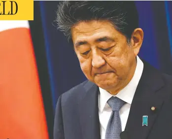  ?? FRANCK ROBICHON/ POOL / GETTY IMAGES ?? Japanese Prime Minister Shinzo Abe announces that he is stepping down due to health concerns at a news conference at his official residence in Tokyo on Friday. Abe told reporters that he has been “struggling” with his health.