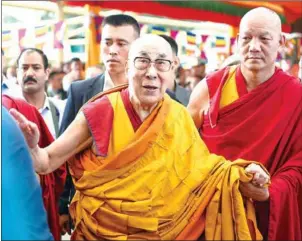  ?? LOBSANG WANGYAL/AFP ?? Tibetan spiritual leader the Dalai Lama arrives for a long-life prayer offering dedicated to him at Tsuglagkha­ng Temple in McLeod Ganj in India.