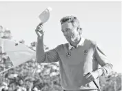  ??  ?? Bernhard Langer tips his cap after completing his round on Saturday at the Masters.