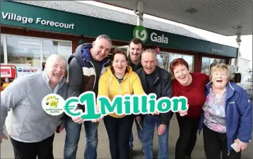  ??  ?? The owners of the service station Jack and Rita Greene (2nd and 3rd from left) with staff and local shoppers Ann Fenlon, Ken Murphy, Mick Cogley, Charlene Travers (staff) and Mary Carton.