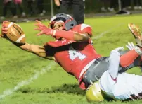  ?? SHARON MERKEL/SPECIAL TO THE MORNING CALL ?? Parkland’s Jendel Sanchez makes a catch and reaches for the end zone Friday against Whitehall.