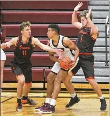  ?? RANDY WIMER / CONTRIBUTE­D ?? Lebanon’s Harrison Hookfin is guarded by Beavercree­k’s Jon Alessandro (11) and Adam Graeter during Friday night’s game at Lebanon.