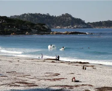  ??  ?? SURFING CARMEL BEACH, above.