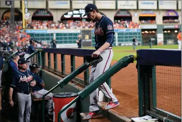  ?? Associated Press ?? Headed to the dugout: Atlanta Braves starting pitcher Max Fried leaves the game during the sixth inning in Game 2 of baseball's World Series between the Houston Astros and the Atlanta Braves Wednesday in Houston.