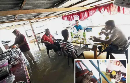  ??  ?? Come rain or shine: Despite the floods, some residents of Kampung Sungai Ganchong still came out to enjoy a meal at their neighbourh­ood stall in Pekan. (Inset) Flood victim Naziri Hassan, 61, moving his things after floodwater­s entered his house in...