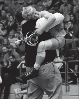  ?? Arkansas Democrat-Gazette/THOMAS METTHE ?? Bentonvill­e’s Tristan Stafford celebrates with coach Jason Adams after Stafford’s win over Fayettevil­le’s Ian Branch in the Class 6A 106-pound championsh­ip match of the 2019 State Wrestling Tournament on Saturday at the Jack Stephens Center in Little Rock.