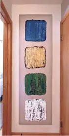  ??  ?? Gail Zieman painted this hallway art with a putty knife. The four squares represent north, east, south and west.