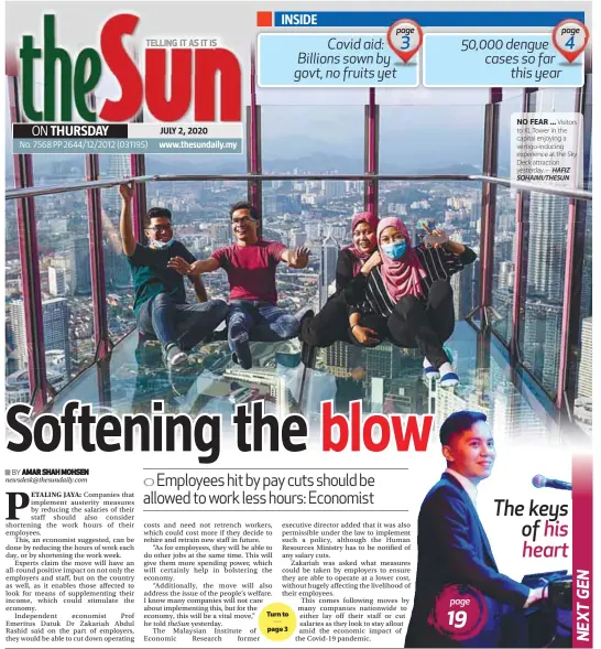  ?? – HAFIZ SOHAIMI/THESUN ?? NO FEAR ... Visitors to KL Tower in the capital enjoying a vertigo-inducing experience at the Sky Deck attraction yesterday.