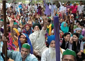  ?? AP/TSERING TOPGYAL ?? Indian farmers demand debt relief and better prices for their produce as they protest Thursday in New Delhi against Prime Minister Narendra Modi.