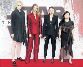  ?? JOEL C RYAN/INVISION ?? Actresses Gwendoline Christie, from left, Laura Dern, Daisy Ridley and Kelly Marie Tran pose for photograph­ers at the photo call for Star Wars: The Last Jedi in London, Wednesday.