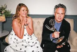  ?? Associated Press ?? Mark Ruffalo accepts the award for outstandin­g lead actor in a limited series or movie for “I Know this Much Is True” with wife Sunrise Coigney.