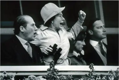  ??  ?? the quee n’s exciteme nt This photo of the Queen at Epsom won numerous awards, and marked the beginning of a special connection between Mike and the Palace