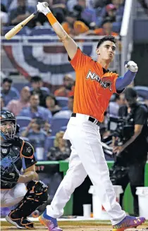  ?? WILFREDO LEE/THE ASSOCIATED PRESS ?? The Dodgers’ Cody Bellinger watches a hit Monday during the Home Run Derby in Miami.