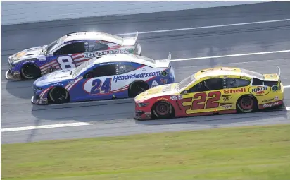  ?? CHRIS GRAYTHEN — GETTY IMAGES ?? Joey Logano (22), William Byron (24) and Corning’s Tyler Reddick (8) race during the NASCAR Cup Series YellaWood 500at Talladega Superspeed­way on Sunday in Talladega, Ala.