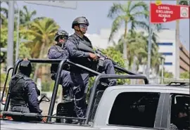  ?? Gary Coronado Los Angeles Times ?? ACAPULCO police on patrol in April. President Andres Manuel Lopez Obrador’s more holistic approach to fighting crime has not yet translated into safer streets.