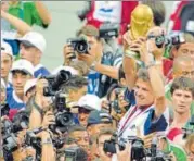  ?? GETTY IMAGES ?? ▪ France coach Aime Jacquet lifts the World Cup after the hosts stunned Brazil 30 in the final on July 12, 1998.