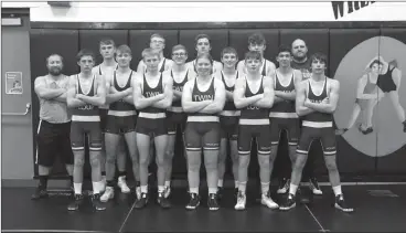  ?? Emily Tobias ?? The 2020-2021 Twin Loup Wrestling Team from Bottom Row Left are: David Switzer, Wyatt Olson, Ally Micheel, Garrett Keith, and Ethan Kipp. Middle Row: Head Coach Levi Likens, Shawn Quandt, Nolan Osborn, Keaton Dowse, and Hector Estrada. Back Row: Archer Grint, Kade Bottorf, Garett Schneider, Slate Micheel, and Assistant Coach Tony Bye.