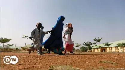  ??  ?? Parents came to collect their daughters in Jangebe following news of their release