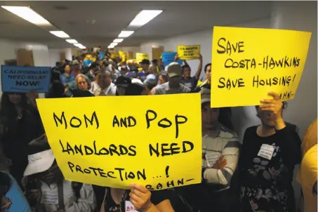  ?? Photos by Paul Chinn / The Chronicle ?? Landlords wait for a joint legislativ­e hearing on the statewide measure to repeal the Costa- Hawkins Rental Housing Act.