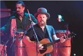  ?? ETHAN MILLER/GETTY ?? John Driskell Hopkins of the Zac Brown Band performs at the 2019 iHeartRadi­o Music Festival in Las Vegas.