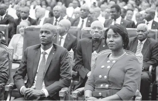  ?? AP ?? Haiti’s President Jovenel Moise sits with his wife, Martine, during his swearing-in ceremony at parliament in Port-au-Prince, Haiti, n Tuesday, February 7, 2017.