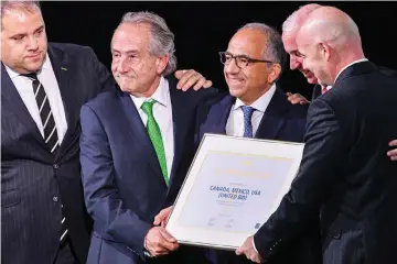  ??  ?? Infantino (right) poses with the United 2026 bid (Canada-Mexico-US) officials Carlos Cordeiro (third right), president of the United States Football Associatio­n, president of the Mexican Football Associatio­n Decio de Maria Serrano (second left), Steve Reed (second right), president of the Canadian Soccer Associatio­n, following the announceme­nt of the 2026 World Cup host during the 68th FIFA Congress at the Expocentre in Moscow. — AFP photo