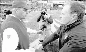  ?? STEVEN SENNE/THE ASSOCIATED PRESS ?? Bills coach Rex Ryan, left, and Patriots coach Bill Belichick shake hands after Buffalo’s 16-0 victory at Foxborough, Mass., on Oct. 2 when New England was without suspended quarterbac­k Tom Brady.