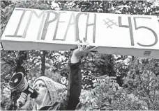  ?? LATHAN GOUMAS, THE (LYNCHBURG, VA.) NEWS & ADVANCE, VIA AP ?? Jennifer Lewis protests Saturday before President Trump speaks at Liberty University’s graduation in Lynchburg, Va.