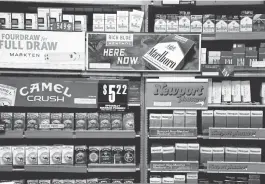  ?? GENE J. PUSKAR/ASSOCIATED PRESS ARCHIVES ?? Newport and Camel are among Reynolds American’s brands. The proposed deal values Reynolds, based in Winston Salem, North Carolina, at $93 billion.