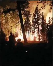  ??  ?? A group of Pennsylvan­ia firefighte­rs, including Jean Pfister, fight a California forest fire in August.