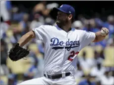  ??  ?? Los Angeles Dodgers starting pitcher Clayton Kershaw throws against the Chicago Cubs during the first inning of a baseball game in Los Angeles on Thursday. AP PHOTO/CHRIS CARLSON