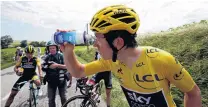  ?? REUTERS ?? The eyes have it . . . Team Sky rider Geraint Thomas, of Britain, wearing the leader’s yellow jersey, cleans his eyes after they were affected by tear gas used by police to disperse a protest by farmers along the stage.