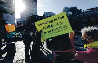  ?? MICHAEL DWYER — THE ASSOCIATED PRESS ?? Tenants’ rights advocates demonstrat­e outside the Edward W. Brooke Courthouse in Boston in January. An estimated 8.8 million Americans are behind on their rent, according to the Consumer Financial Protection Bureau.