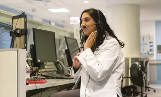  ??  ?? Dr. Meeta Shah speaks with a patient via a video chat at Rush Hospital in early August. ANTHONY VAZQUEZ/SUN-TIMES