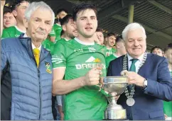  ?? (Pic: P O’Dwyer) ?? Harbour Rovers captain, Eric O’Donoghue accepting the North Cork JAHC Cup from the Mayor of County Cork, Cllr Frank O’Flynn in the presence of Arthur O’Keeffe (Avondhu GAA Board chairman) following the Hibernian Hotel Avondhu JAHC final versus Kilshannig.